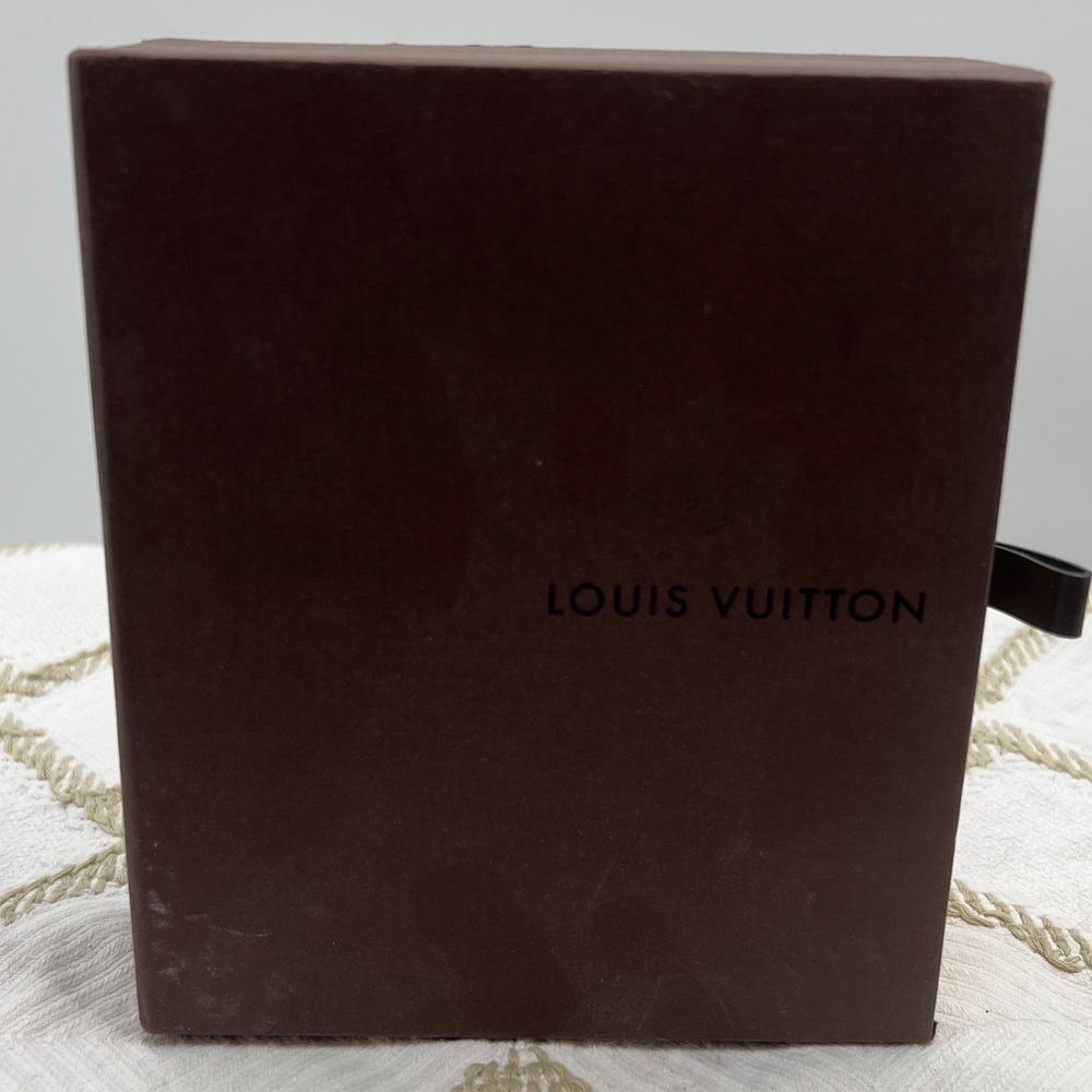 Empty Louie Vuitton belt box.